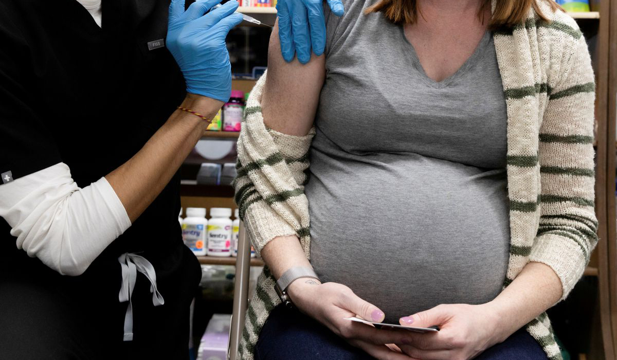 A pregnant woman receives a vaccine